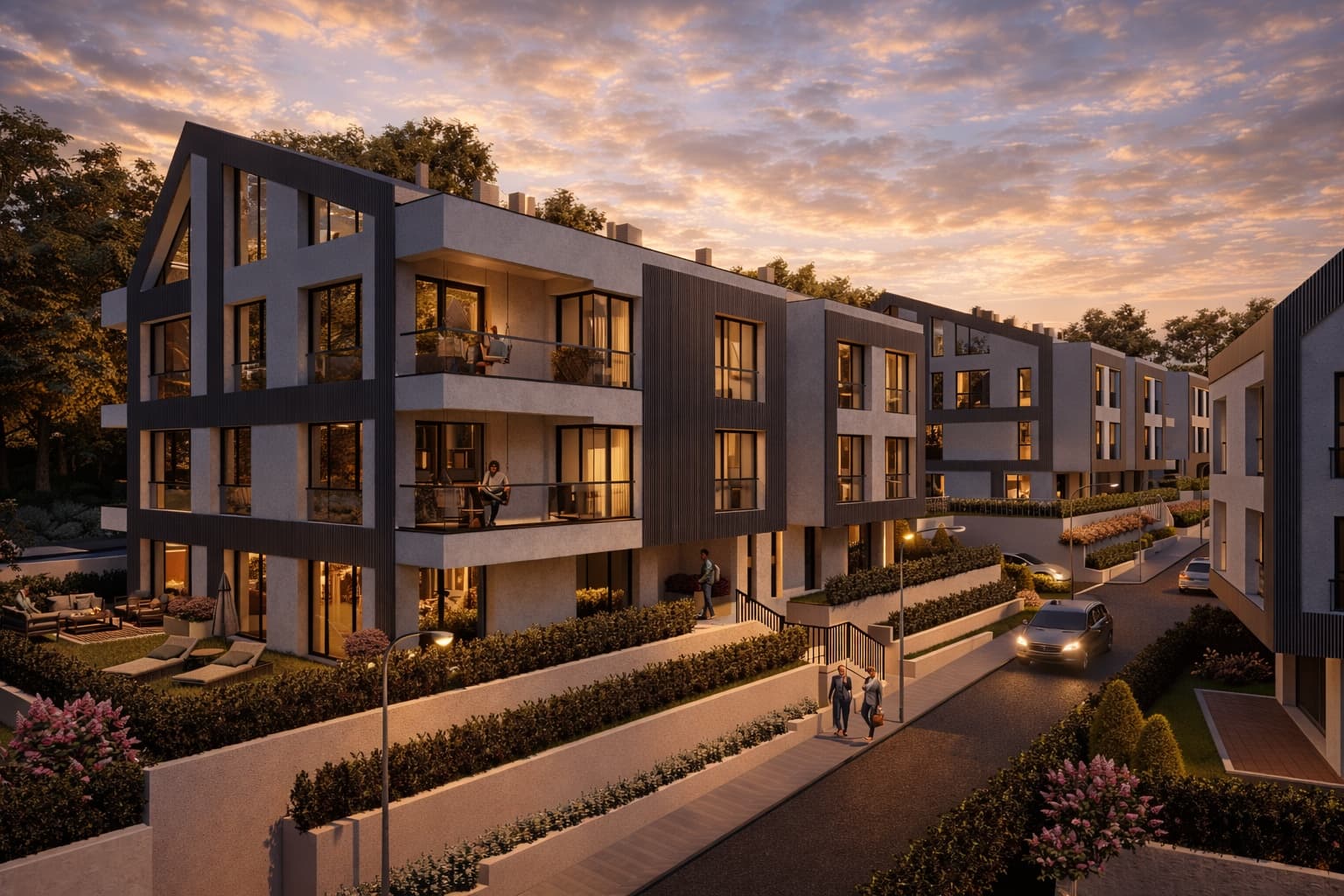 Двама души вървят по алеята на ALTEA RESIDENCE привечер