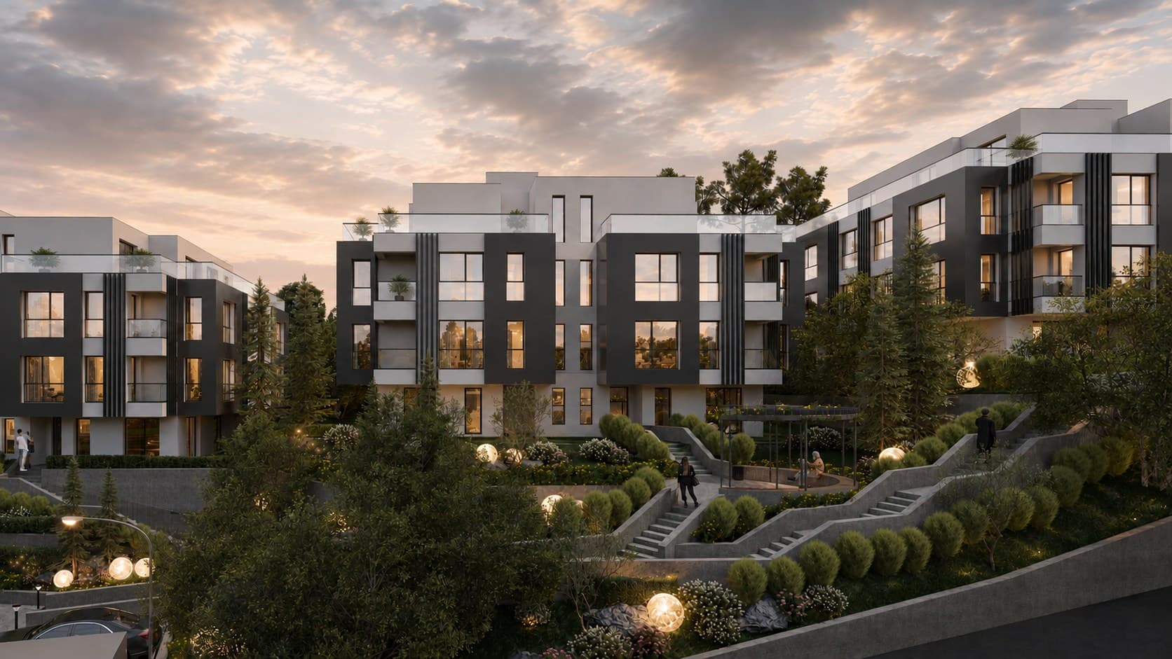Жилищни сгради в ALTEA RESIDENCE зад богато озеленена градина по залез