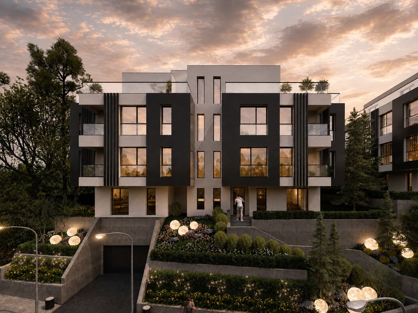 Фронтален вечерен изглед към жилищна сграда в ALTEA RESIDENCE с осветена градина